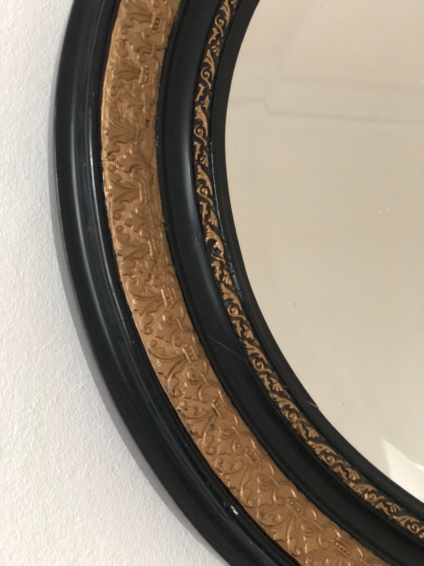 Antique Carved Louis Philippe Oval Mirror In Black and Gold France Late 19th Century