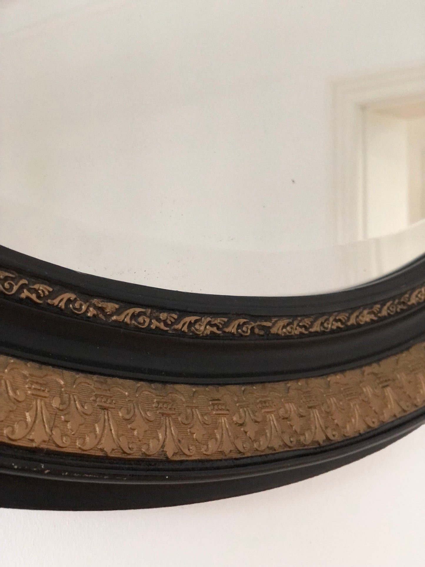 Antique Carved Louis Philippe Oval Mirror In Black and Gold France Late 19th Century