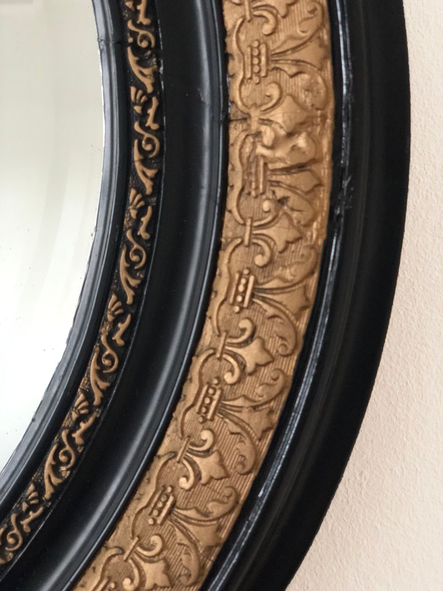 Antique Carved Louis Philippe Oval Mirror In Black and Gold France Late 19th Century