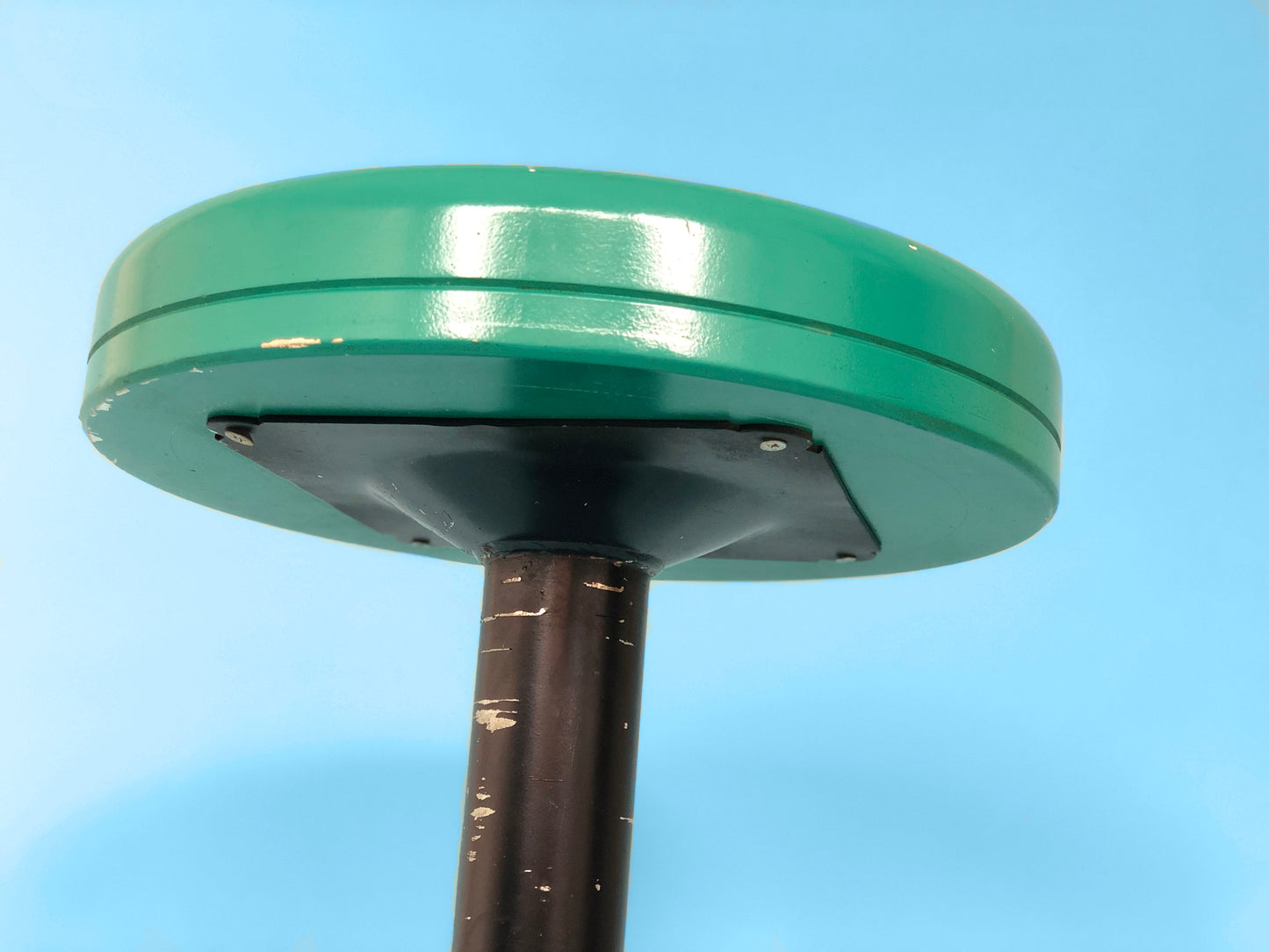 green industrial stool