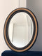 Antique Carved Louis Philippe Oval Mirror In Black and Gold France Late 19th Century