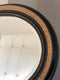 Antique Carved Louis Philippe Oval Mirror In Black and Gold France Late 19th Century