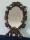 French Walnut Carved Black Forest Oval Mirror 1900s