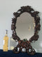 French Walnut Carved Black Forest Oval Mirror 1900s